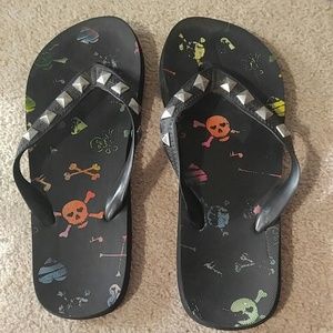 Black studded flip flops w/ rainbow skulls